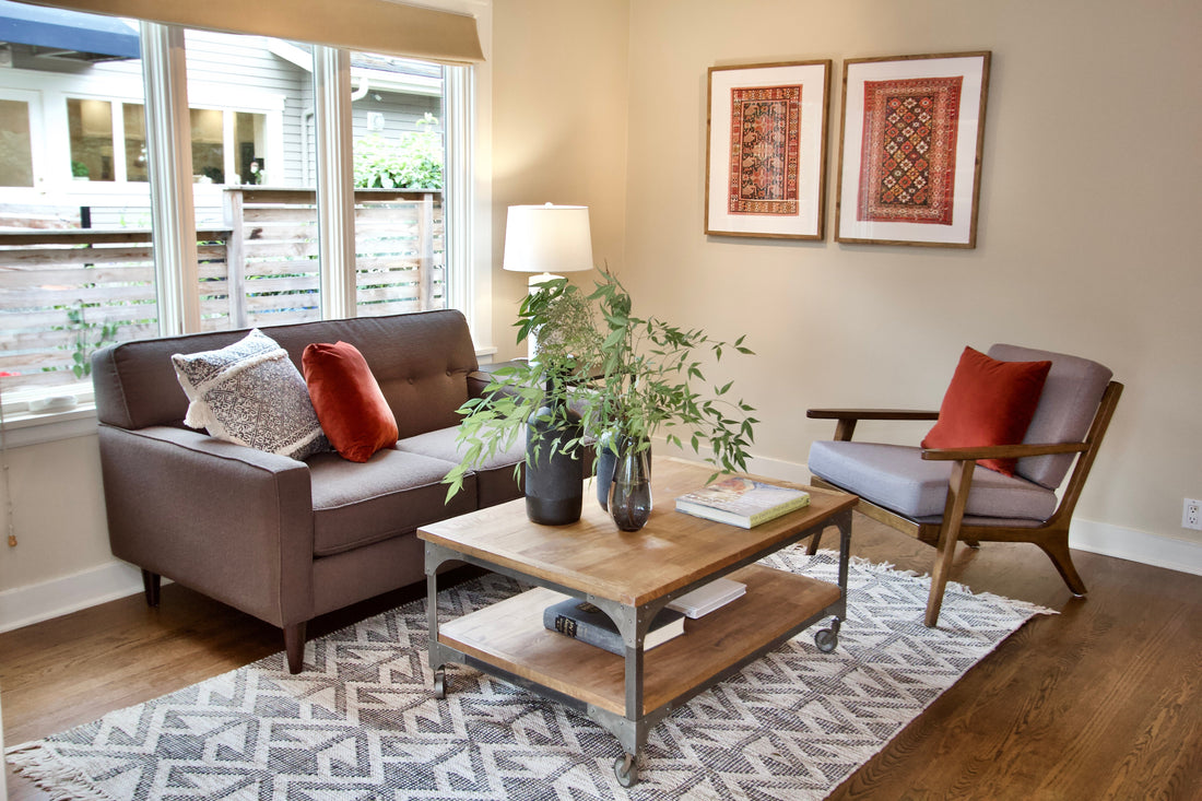 Living room seating with a sofa, armchair and table lamp.